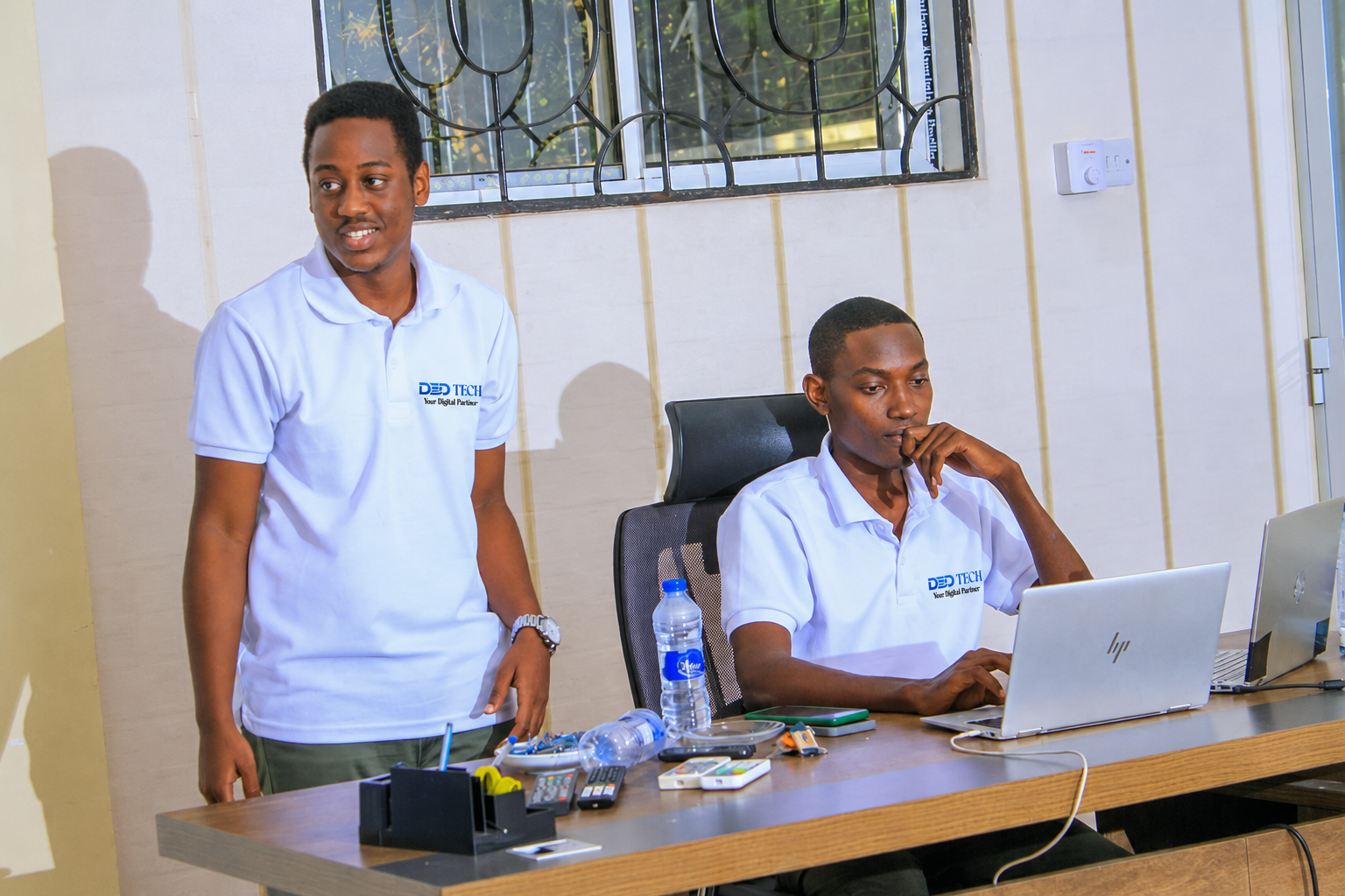 African software engineers collaborating in a modern Dar es Salaam office